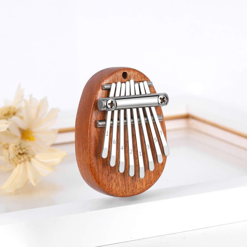 Elejolie Mini Kalimba Thumb Piano 8 Key,Finger Piano Finger Harp Portable Musical Instruments Gift for Kids Adult with Pendant 8key
