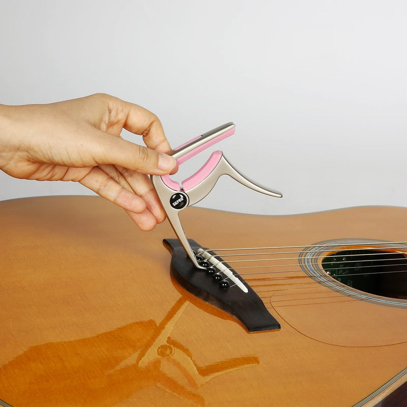 Guitar Capo 3-in-1: Acoustic & Electric Capo, Guitar Pin Puller, Pick Holder - Hidden Spring Design, Trapezoid Silicone Rubber Pad, Superior Zinc Alloy (Pink) Pink
