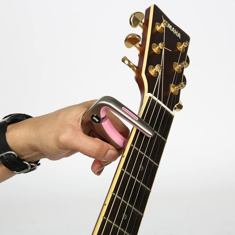 Guitar Capo 3-in-1: Acoustic & Electric Capo, Guitar Pin Puller, Pick Holder - Hidden Spring Design, Trapezoid Silicone Rubber Pad, Superior Zinc Alloy (Pink) Pink