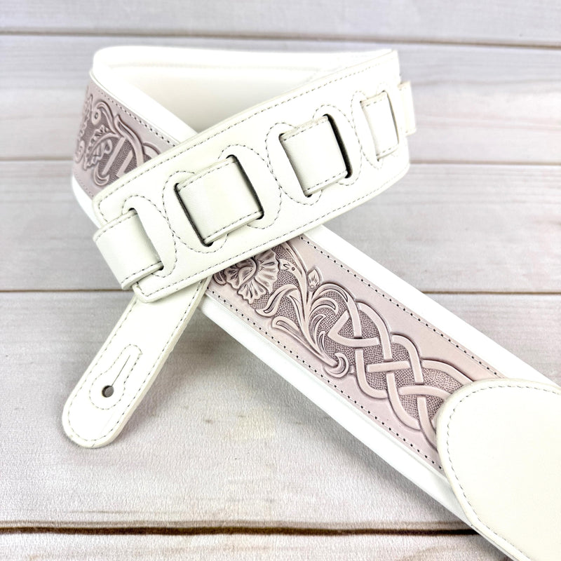 Walker And Williams KB-05-WHT Aged White Celtic Knot Full Grain Carving Leather Padded Strap With Arctic White garment leather Backing For Acoustic, Electric, And Bass Guitars
