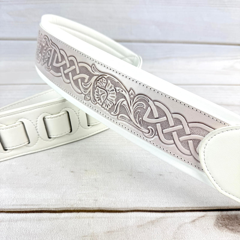 Walker And Williams KB-05-WHT Aged White Celtic Knot Full Grain Carving Leather Padded Strap With Arctic White garment leather Backing For Acoustic, Electric, And Bass Guitars