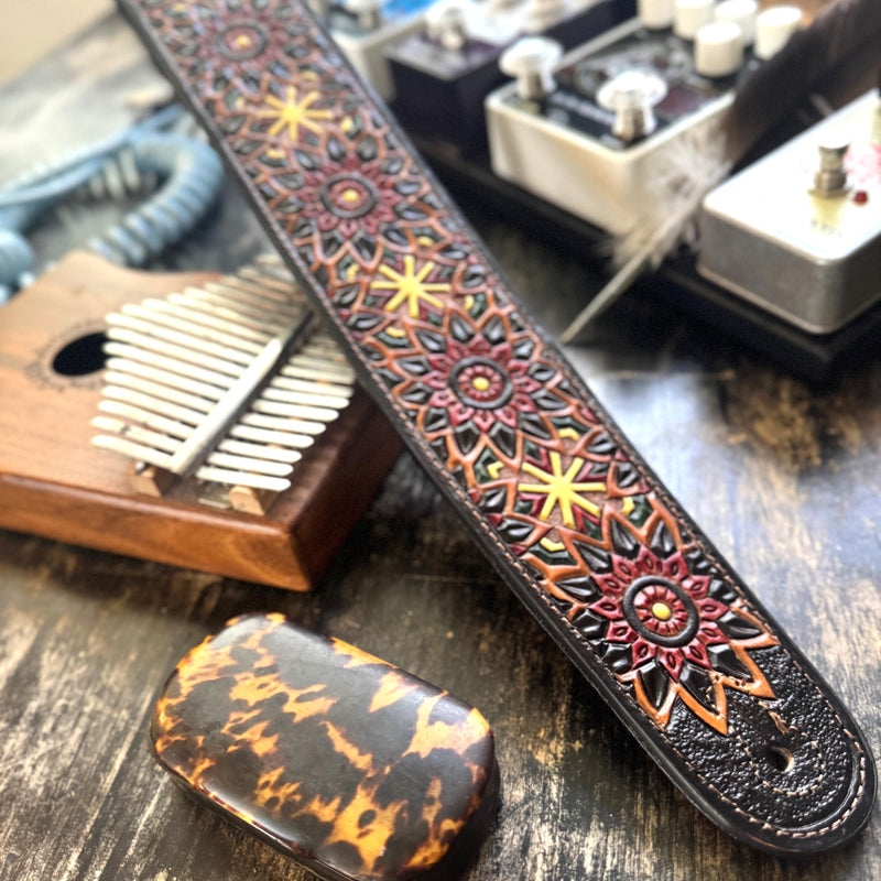 Walker & Williams LIH-2 Black And Brown Hand Carved Premium Leather Guitar Strap With Gold Earth Zodiac Star Design And Premium Padded Back For Acoustic, Electric, And Bass Guitars