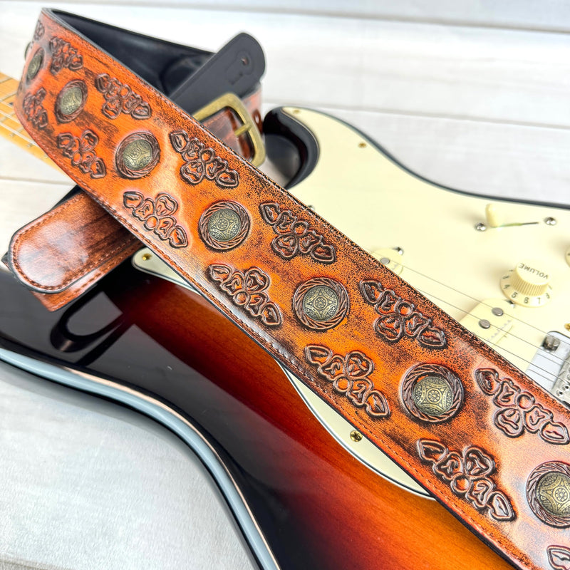 Walker & Williams GE-202 Antique Amber Tan Padded Guitar Strap with Brass Coin Studs, Brass Buckle, And Celtic Tooling For Acoustic, Electric, And Bass Guitars