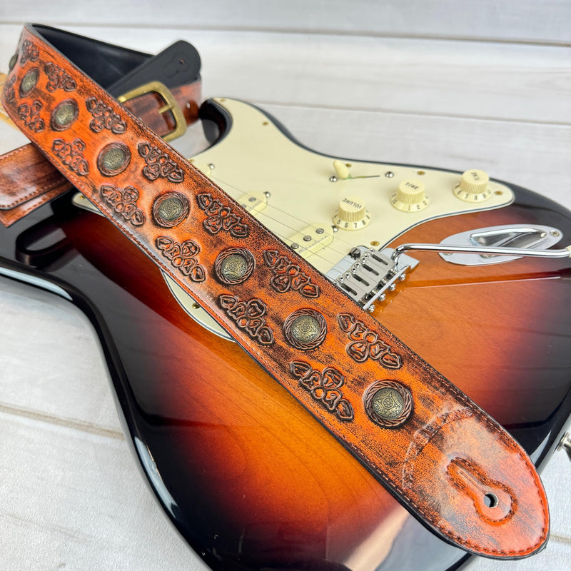 Walker & Williams GE-202 Antique Amber Tan Padded Guitar Strap with Brass Coin Studs, Brass Buckle, And Celtic Tooling For Acoustic, Electric, And Bass Guitars
